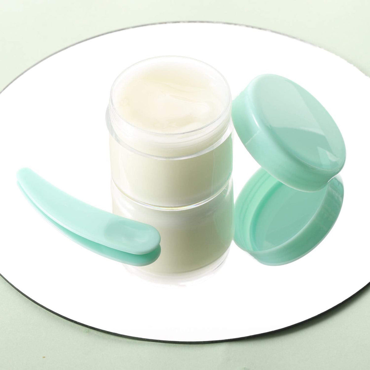 Refillable Cosmetic Sample Jars - 100 Pack 20g (0.7oz) Green Small Travel Containers with Lids + 10 Mini Makeup Spatulas - BPA Free