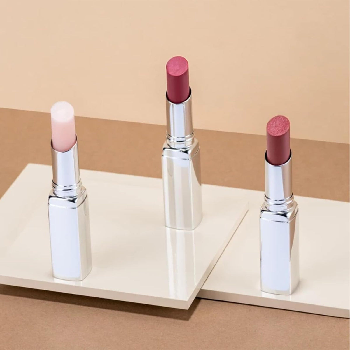 ARTDECO Color Booster Lip Balm in coral - nourishing lip balm with color-adapting pigments - lip plumper with spearmint flavor - prevents dryness & chapping - lip care with kernel oil - 0.1 Oz