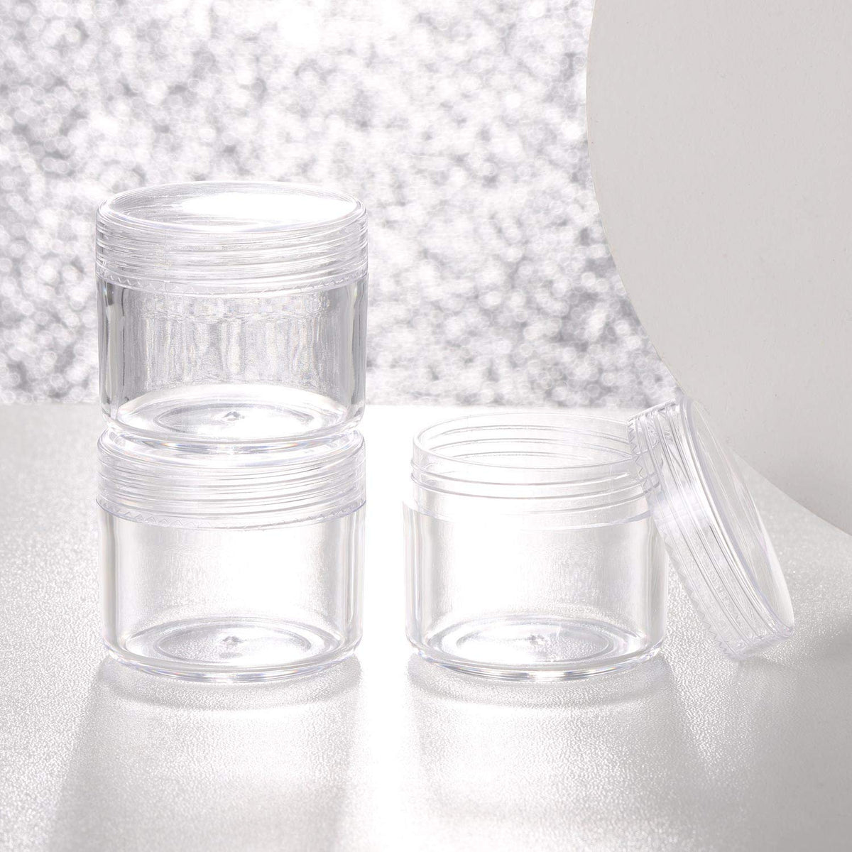 Refillable Cosmetic Sample Jars - 100 Pack 20g (0.7oz) Clear Small Travel Containers with Lids + 10 Mini Makeup Spatulas - BPA Free